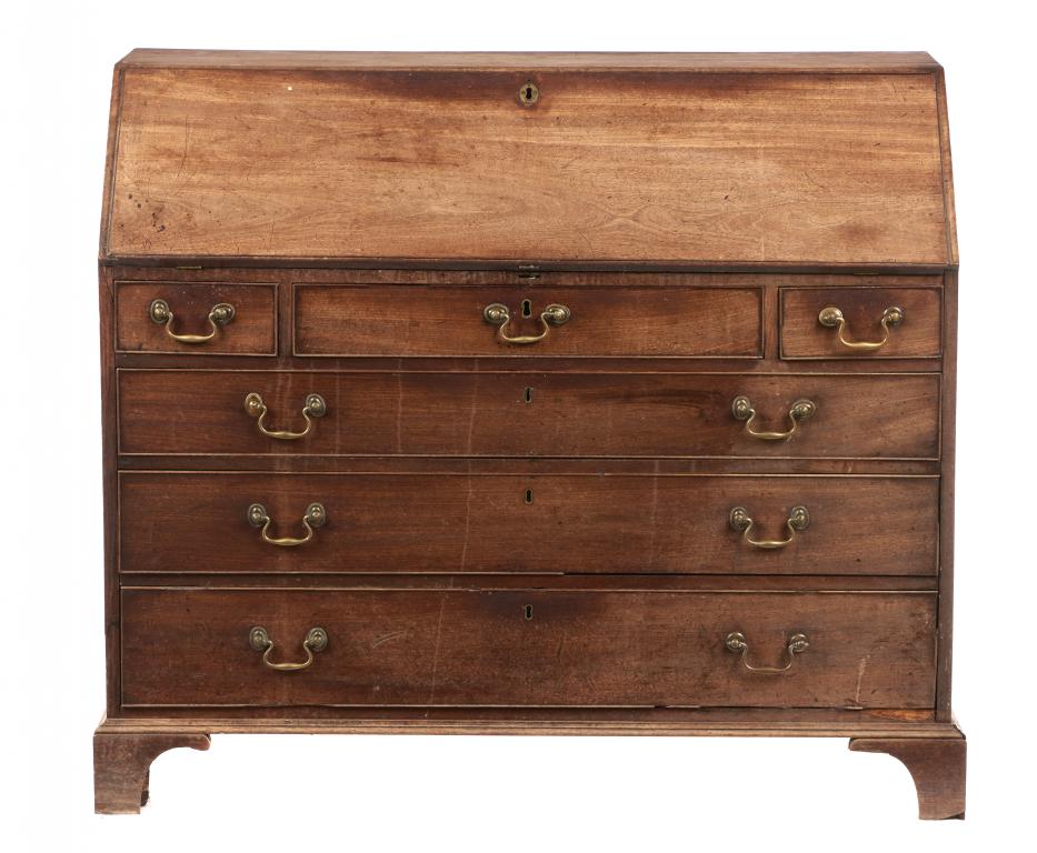 A GEORGE III MAHOGANY BUREAU, C1800 the fitted interior centred by a door with oval patera, 106cm h;