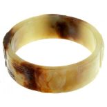 A CHINESE CARVED NEPHRITE BANGLE, 19TH/20TH C with ying and yang, 73mm++Good condition