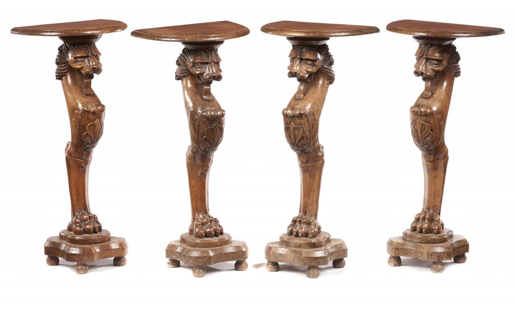 A SET OF FOUR ITALIAN WALNUT 'ROMAN' LION MONOPODIUM LEG STANDS, PROBABLY ITALIAN, LATE 18TH/19TH