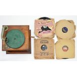 AN OAK TABLE GRAMOPHONE AND A COLLECTION OF RECORDS