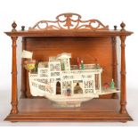 A CARVED AND PAINTED CHINESE IVORY PLEASURE BOAT IN A FITTED GLAZED CASE, EARLY 20TH C, 46 X 43CM