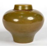 A CHINESE STONEWARE JAR AND COVER WITH DARK OLIVE CELADON GLAZE, 11.5CM H, IMPRESSED MARK, 20TH C