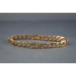 A modern 9ct gold textured and filed curb bracelet,