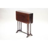 An Edwardian mahogany Sutherland table, crossbanded with inlaid paterae, on turned legs,