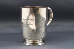 A Victorian silver christening mug with a scroll handle and engraved with two children in a meadow