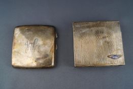 An early 20th century concave cigarette case engraved with script initials, 8cm wide,