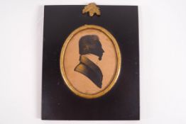 A 19th century silhouette of a Gentleman with gilt highlights,