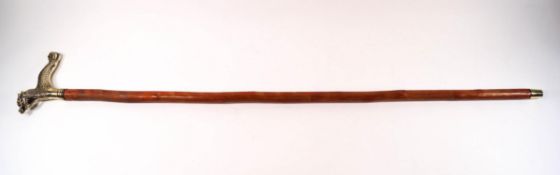 A walking stick with a brass Chinese style dragon handle