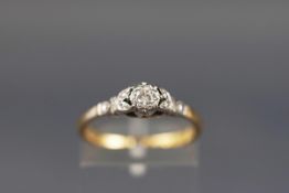 An early 20th century gold and diamond solitaire ring, the round brilliant approx. 0.