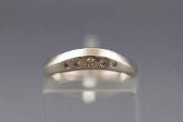 A modern platinum and graduated small round brilliant diamond five stone ring, marks compressed,