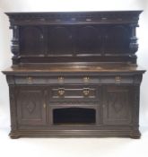 A Victorian carved oak sideboard with Jacobean style decoration,