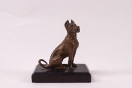 A 19th century style paperweight in the form of a bronze dog surmounted on a black rectangular base,