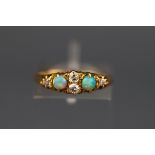 An early 20th century gold, opal and diamond ring, centered with two small old-cut diamonds,