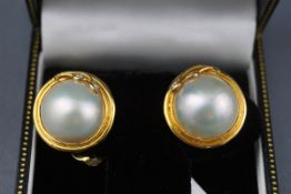 A pair of 18ct gold, mabe pearl and diamond round clip earrings,