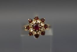 A garnet and paste cluster ring, stamped 'silver', size I+.