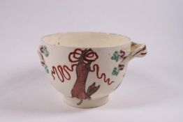 An 18th century creamware bowl, painted with a hung hare and birds in flight,