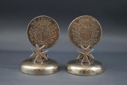 A pair of early 20th century white metal menu holders.