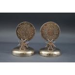 A pair of early 20th century white metal menu holders.