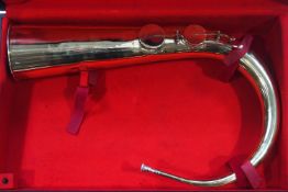 An unusual large brass horn instrument with two stops, 70cm high,