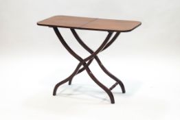 A Victorian mahogany folding coaching table on X-frame and turned supports,