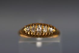 An early 20th century 18ct gold and graduated small old-cut diamond five stone gypsy ring,