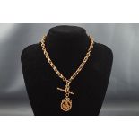 An early 20th century 9ct rose gold fancy link watch chain or albert with swivel terminals and a