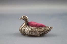 A silver mounted 'duck' pin cushion, Birmingham 1906 by Adie & Lovekin Ltd, approx.