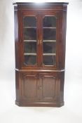 A large 19th century mahogany standing corner cupboard,