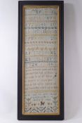 A Victorian alphabet sampler with verse and various motifs below, worked by 'Selina Slade,