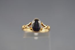 An early 20th century gold and sapphire single stone ring, the oval mixed-cut sapphire approx. 2.