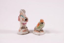 Two 18th century English porcelain miniature figures, possibly Chelsea, one in the form of a cupid,