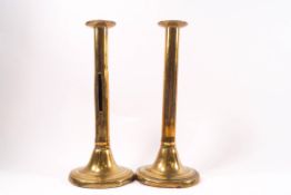 A pair of 17th century brass ejector candlesticks,