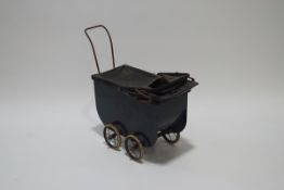 A Victorian child's pram with painted wooden sides and leather hood and cover,