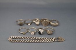 A silver curb link bracelet and nine various gem set rings including marcasite,