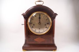 A George III style mahogany bracket clock with line and diamond inlay,