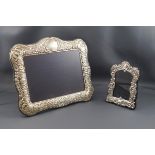 A modern silver mounted photograph frame embossed with foliate scrolls, anthemion and a cartouche,