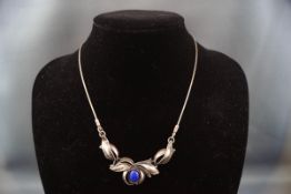 A Continental white metal and lapis lazuli necklace,