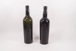 Two 19th century green glass wine bottles,
