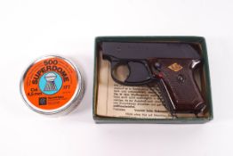 A German 'Perfecta' starting pistol, boxed, with a tin of .