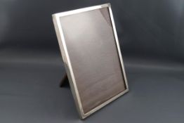A silver mounted rectangular photograph frame, retailed by Emanuel, Southampton,