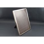 A silver mounted rectangular photograph frame, retailed by Emanuel, Southampton,