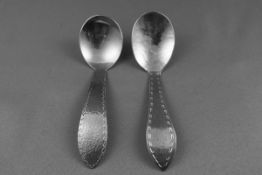 A Keswick School of Industrial Arts (KSIA) staybrite caddy spoon with a hammered bowl and a pointed