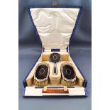 A silver and tortoiseshell mounted small shaped-oblong dressing table set,