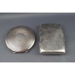 A silver part foliate engraved cigarette case, Birmingham 1921 by Willian Neal Ltd,