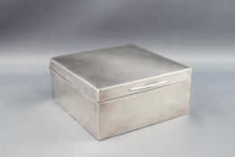 An early 20th century silver mounted square cigarette box, London 1914, 9.