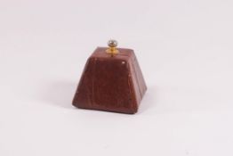 A Mulberry tan leather pyramid desk weight, 5cm high,