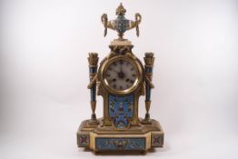 A 19th century French onyx and champleve enamel mantel clock, the onyx dial with Roman numerals,