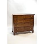 A 19th century mahogany chest of four long drawers with brass handles and bracket feet, 109.