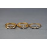 Three gold and diamond rings; comprising,