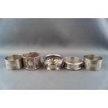 Five various napkin rings including two hallmarked examples,